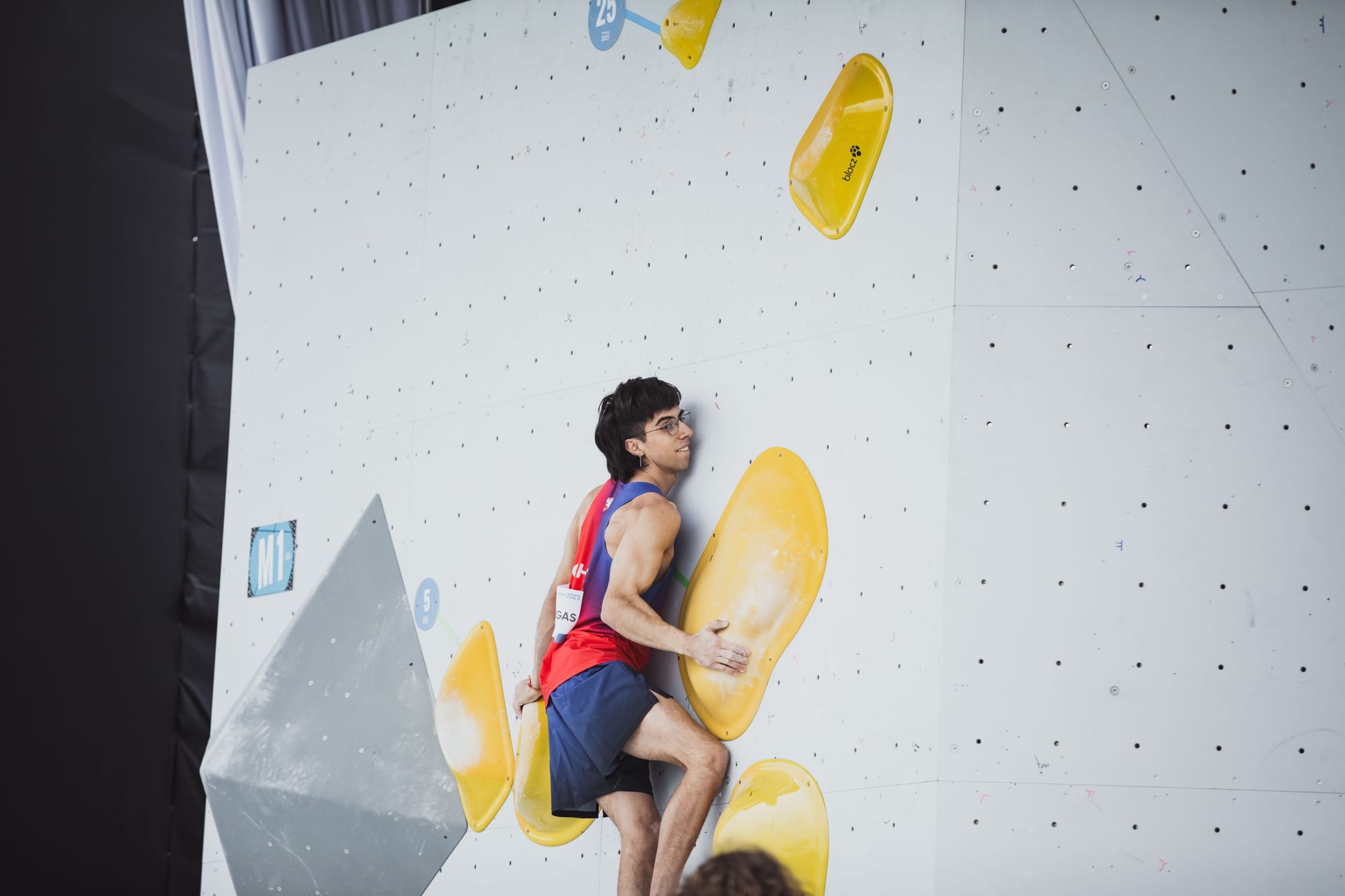 Benjamin Vargas on third boulder on the slab in the semi-final final round