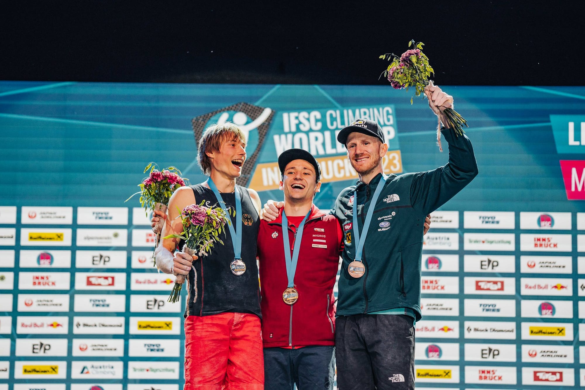 Sascha Lehmann, Alex Megos and Jakob Schubert celebrate their medals.