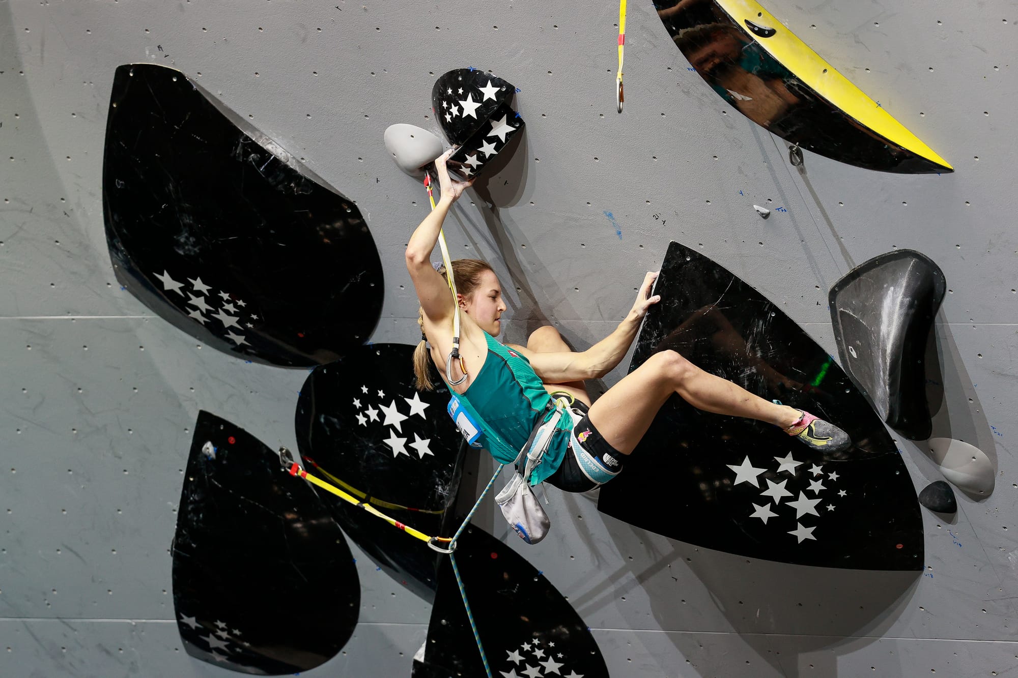 Jessica Pilz drops down while traversing right as she exits the black section of the final route.