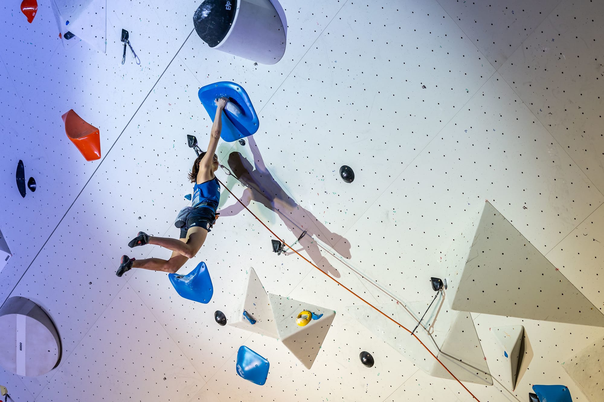 Nonoha Kume of Japan kicking out to a large volume just below the headwall  in the Lead Final during the 2023 Climbing World Cup in Briançon (FRA)