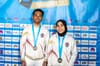 Rajiah Sallsabillah and Rahmad Adi Mulyono with their first gold medals from the IFSC Speed World Cup in Chamonix, 2023