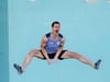 Adam Ondra celebrates topping the last boulder at the Paris Olympics